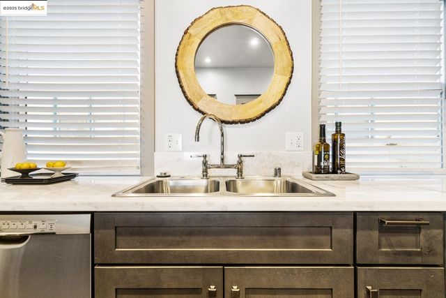a bathroom with a sink a mirror and vanity