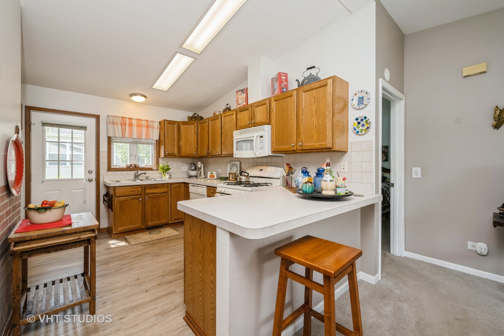 1016 Castleton Court Grayslake, IL 60030 - Photo 7 of 13 a kitchen with a sink appliances and cabinets