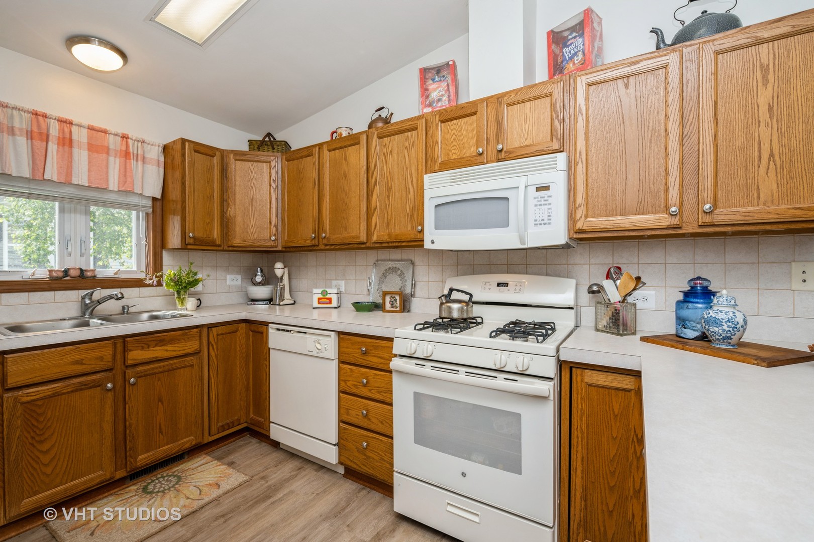 1016 Castleton Court Grayslake, IL 60030 - Photo 8 of 13 a kitchen with stainless steel appliances granite countertop a sink and cabinets