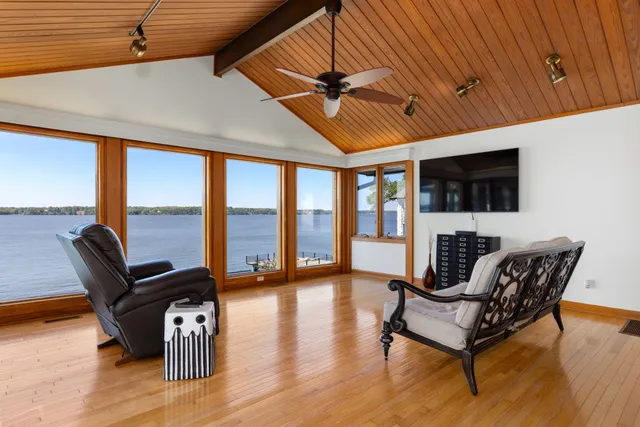 a bedroom with a bed and a table