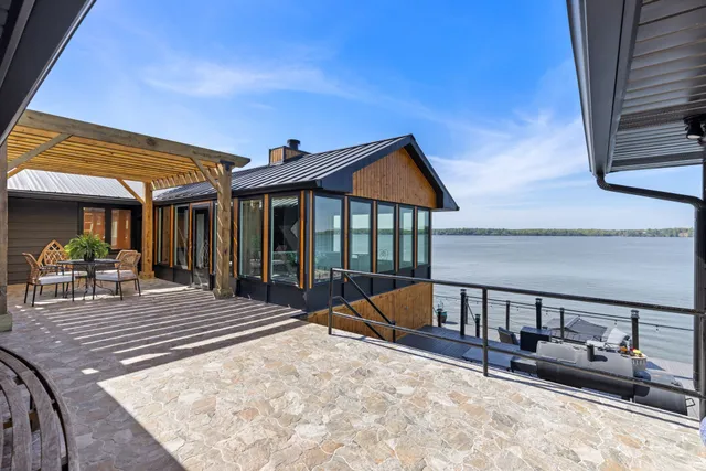 a bathroom with a double vanity sink a mirror and a shower