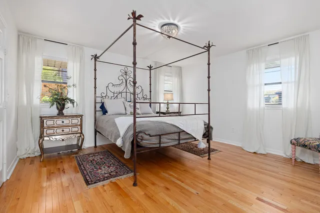 a bathroom with a sink mirror and vanity