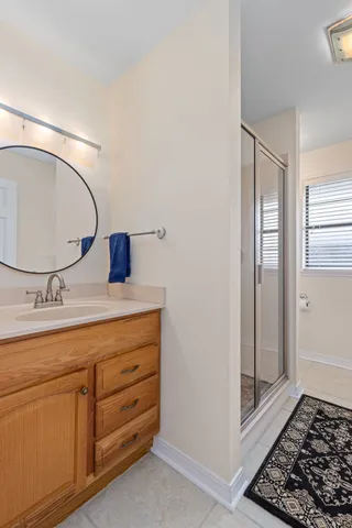 a living room with furniture and floor to ceiling windows