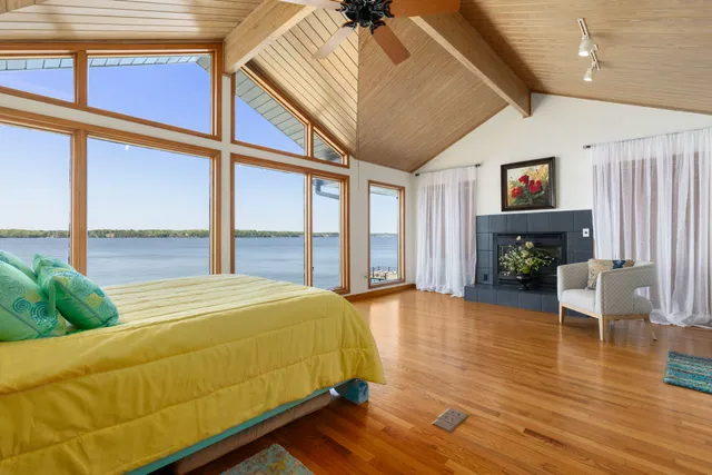 a living room with furniture and large windows