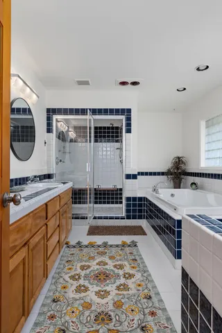 a living room with furniture and large windows