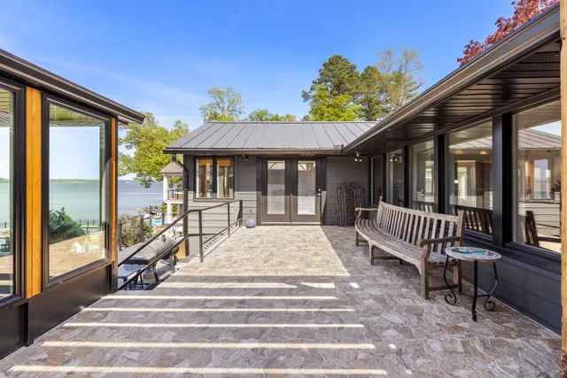 a bedroom with a large bed closet and chandelier