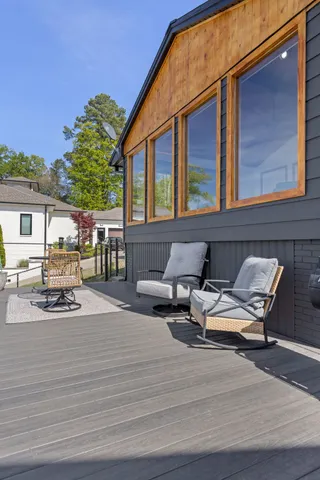 an aerial view of a house with a yard and lake view