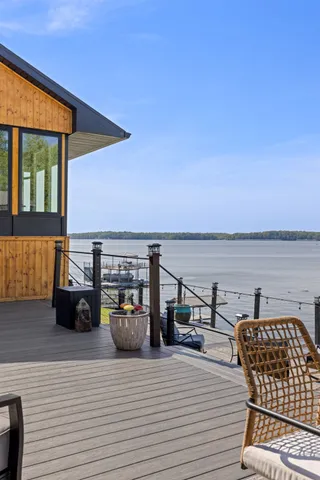 a kitchen with stainless steel appliances granite countertop a sink a stove and cabinets