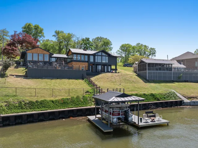 a kitchen with stainless steel appliances granite countertop a sink and a refrigerator