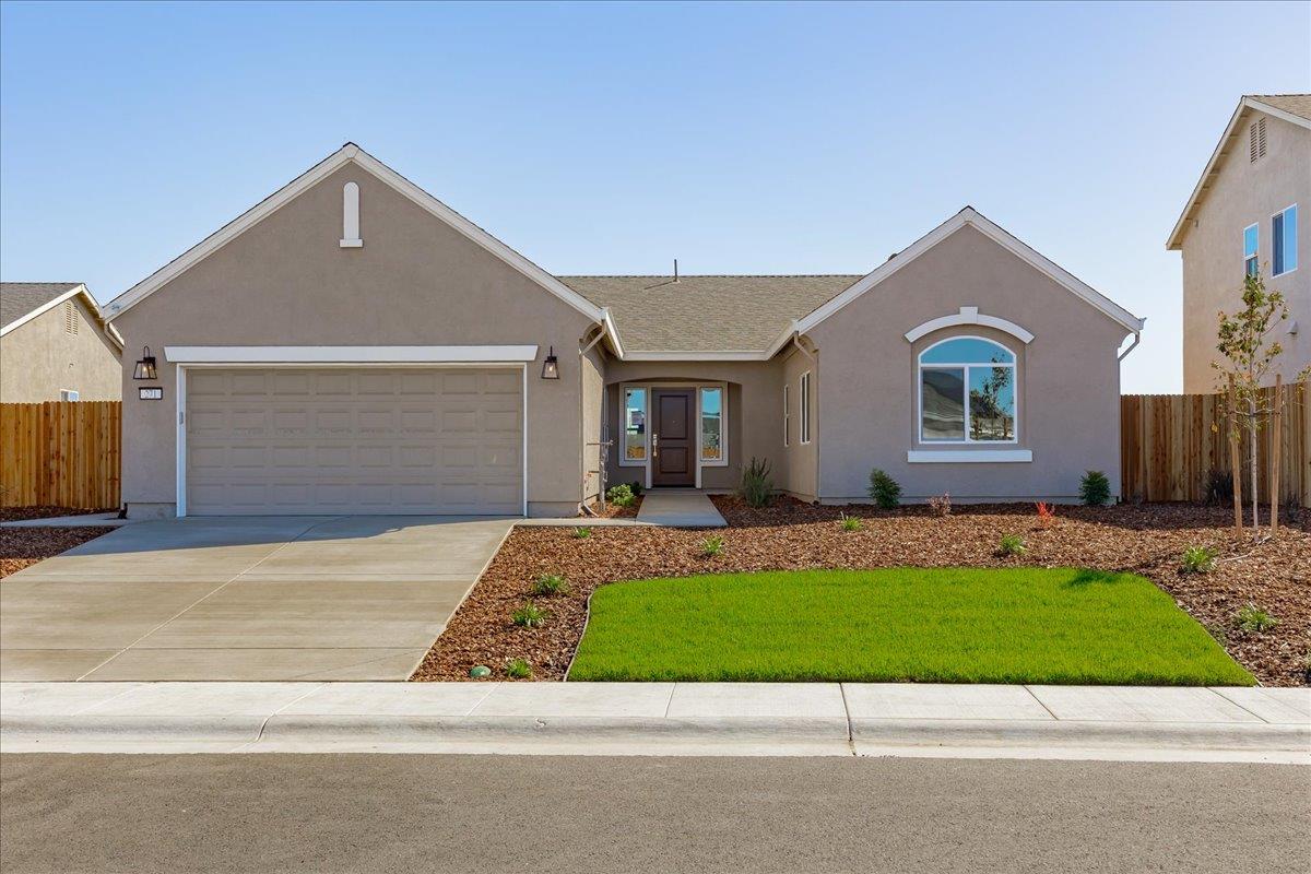 271 Piper Lane Colusa, CA 95932 - Photo 1 of 39 a front view of a house with a yard and garage