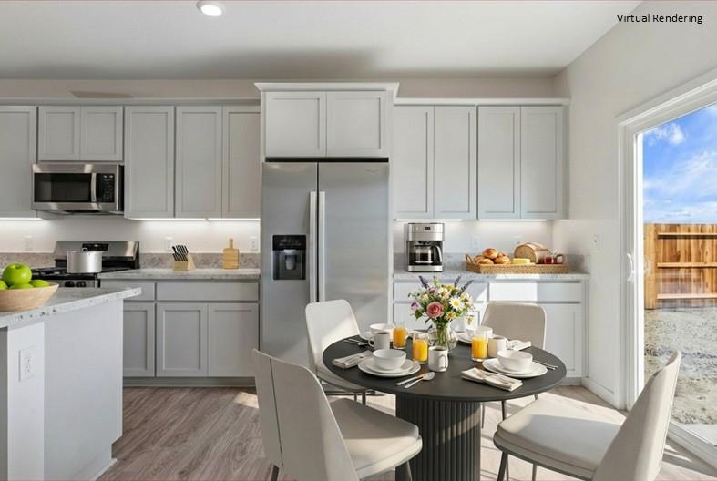 271 Piper Lane Colusa, CA 95932 - Photo 22 of 39 a kitchen with stainless steel appliances kitchen island granite countertop a dining table and chairs