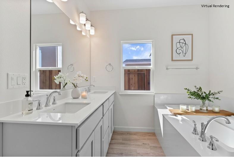 271 Piper Lane Colusa, CA 95932 - Photo 36 of 39 a spacious bathroom with a granite countertop double vanity sink a mirror and a bathtub