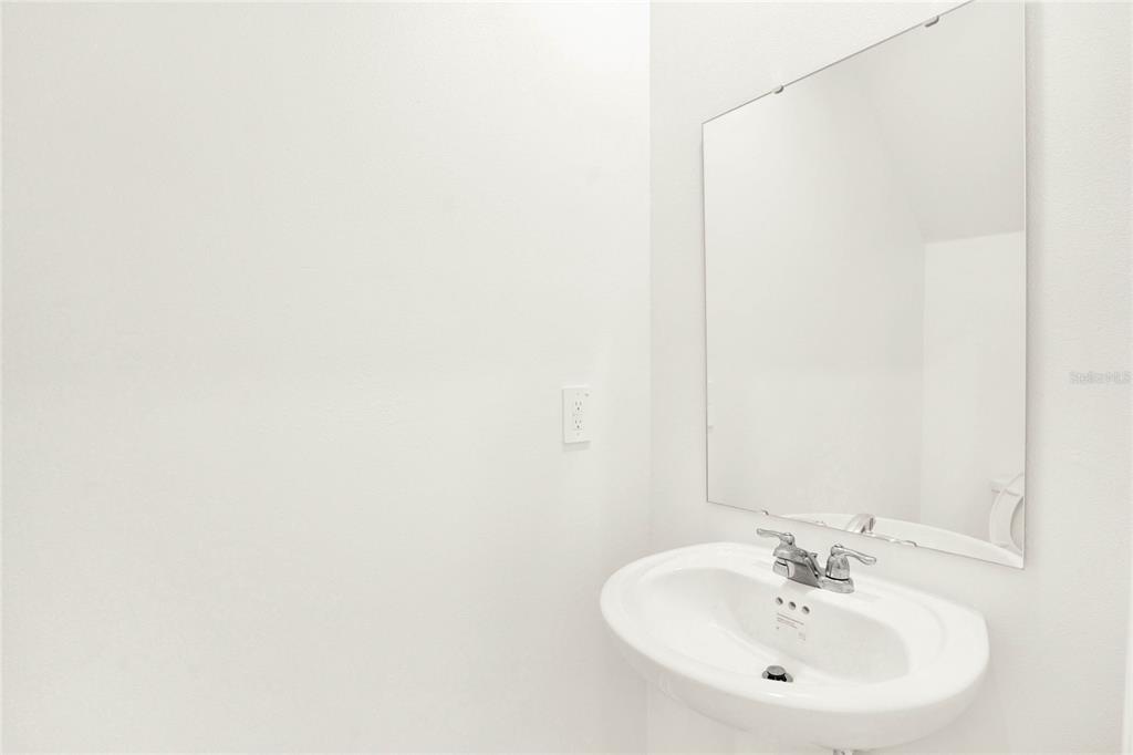 517 Bell Prairie Circle Lake Wales, FL 33859 - Photo 16 of 42 a bathroom with a sink and a mirror