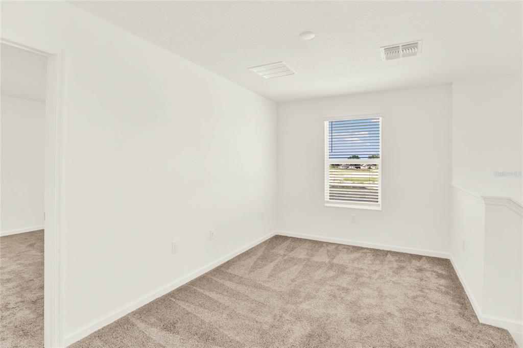 517 Bell Prairie Circle Lake Wales, FL 33859 - Photo 19 of 42 an empty room with windows