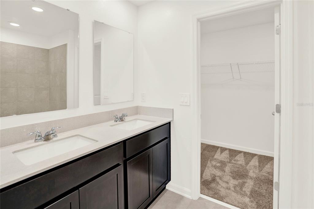517 Bell Prairie Circle Lake Wales, FL 33859 - Photo 24 of 42 a bathroom with a sink a mirror and a vanity