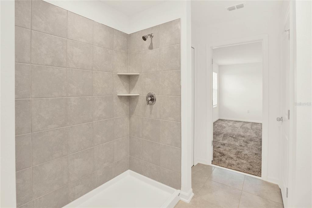 517 Bell Prairie Circle Lake Wales, FL 33859 - Photo 25 of 42 a bathroom with a shower