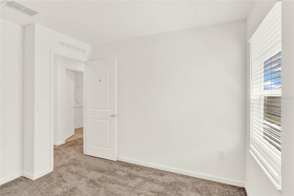 517 Bell Prairie Circle Lake Wales, FL 33859 - Photo 30 of 42 a view of a small space with wooden floor and a window
