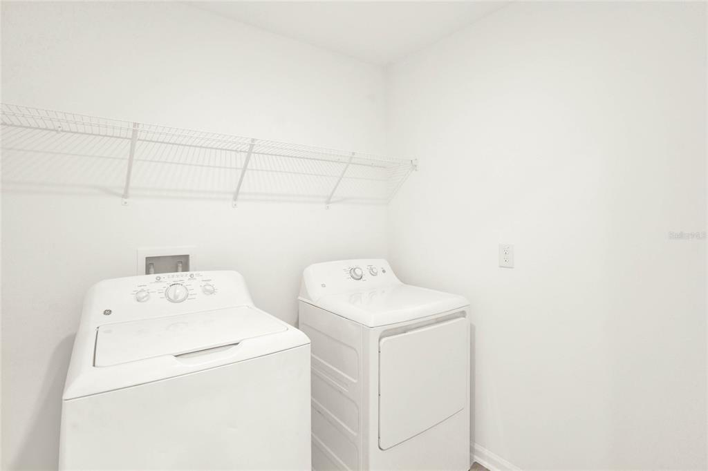 517 Bell Prairie Circle Lake Wales, FL 33859 - Photo 41 of 42 a utility room with dryer and washer