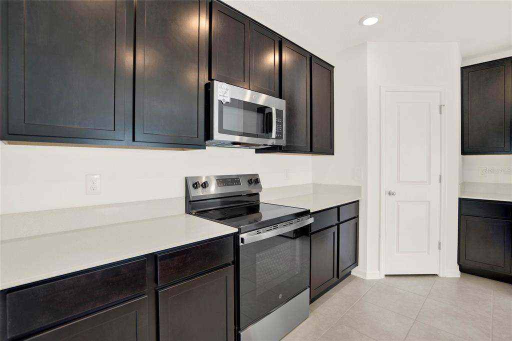 517 Bell Prairie Circle Lake Wales, FL 33859 - Photo 7 of 42 a kitchen with a sink and a microwave