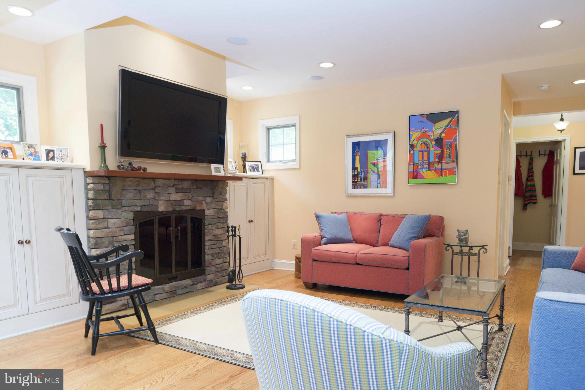 1908 Ruxton Road Baltimore, MD 21204 - Photo 11 of 29 a living room with furniture a flat screen tv and a fireplace