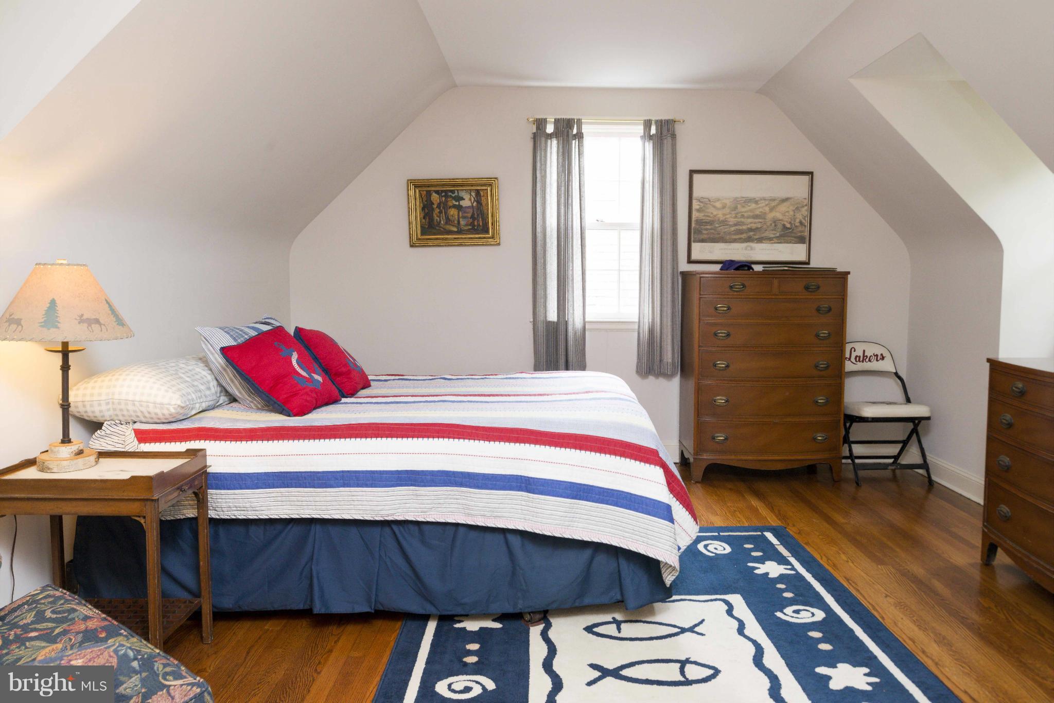 1908 Ruxton Road Baltimore, MD 21204 - Photo 18 of 29 a bedroom with a bed and a dresser