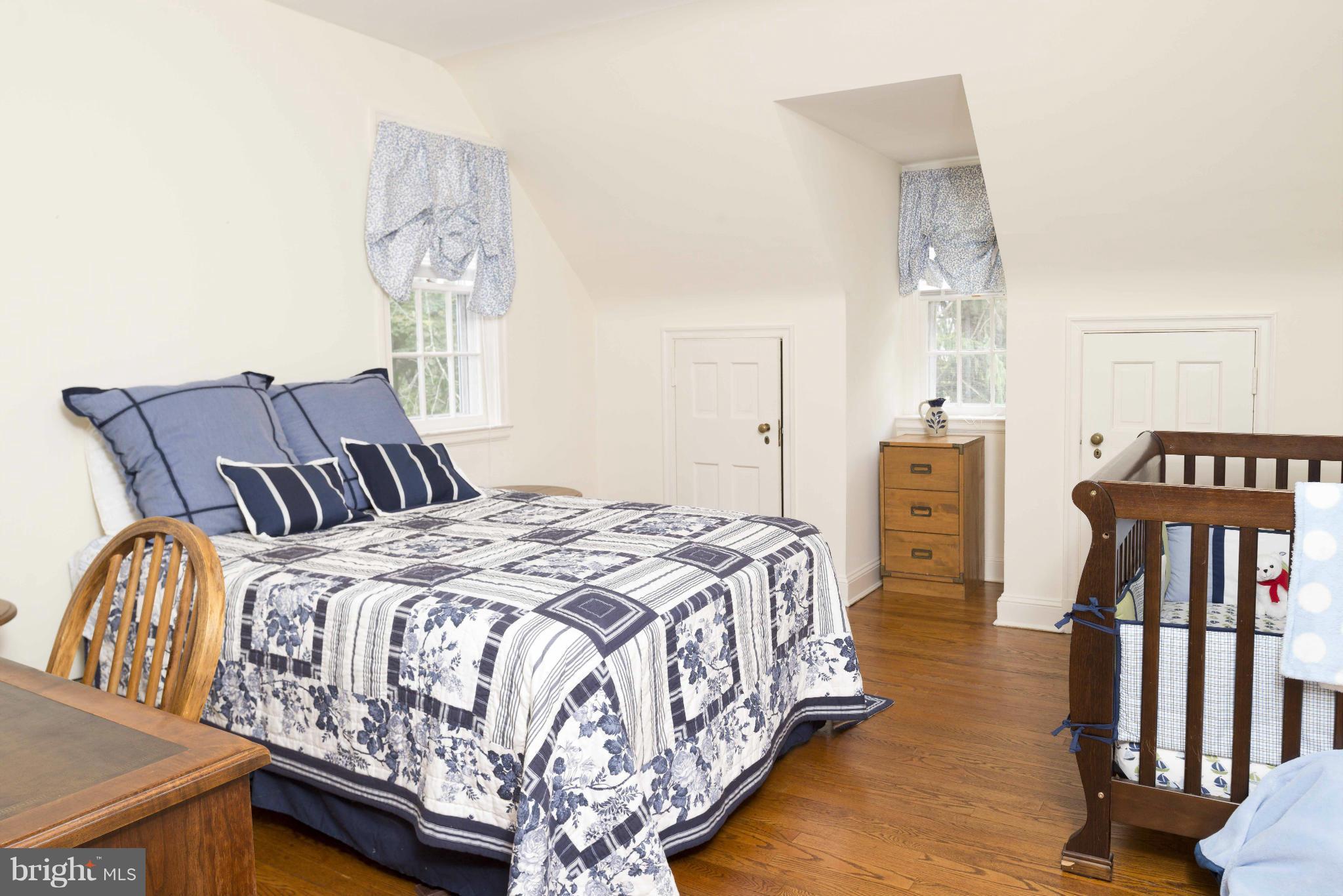 1908 Ruxton Road Baltimore, MD 21204 - Photo 19 of 29 a bedroom with a bed and dresser