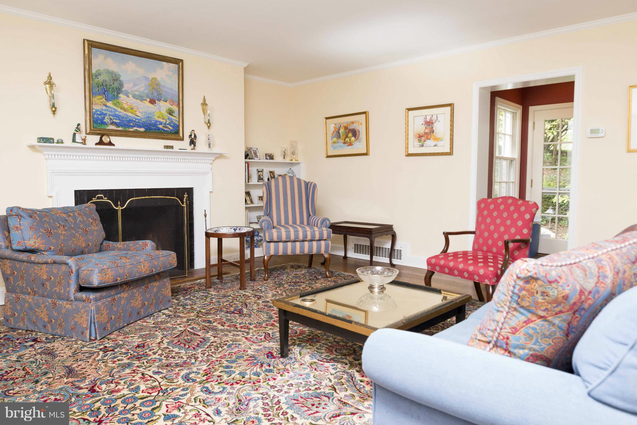 1908 Ruxton Road Baltimore, MD 21204 - Photo 3 of 29 a living room with furniture and a fireplace