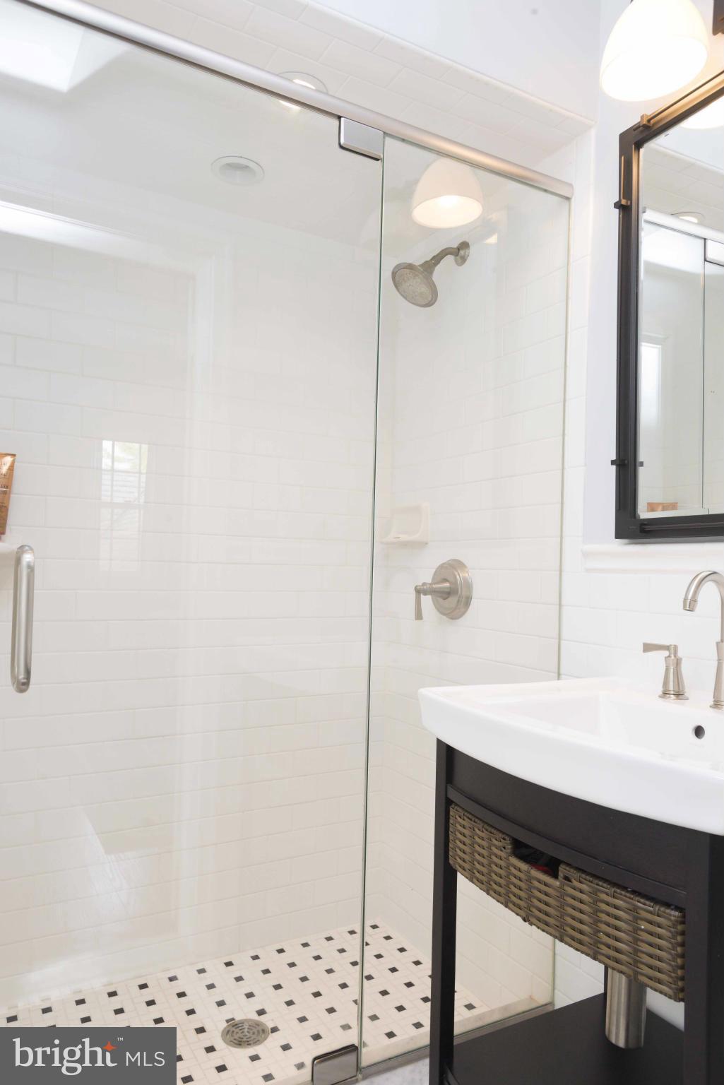 1908 Ruxton Road Baltimore, MD 21204 - Photo 22 of 29 a bathroom with a sink and a mirror