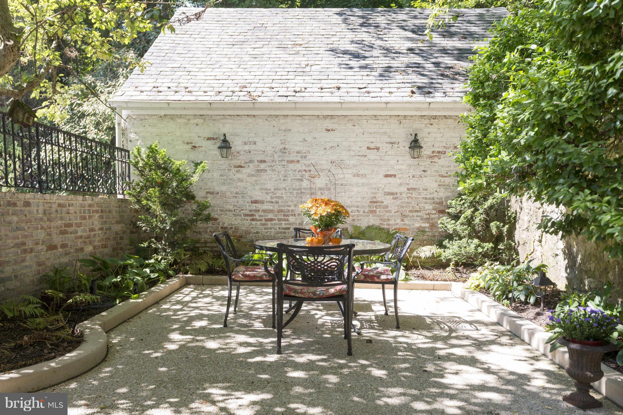 1908 Ruxton Road Baltimore, MD 21204 - Photo 24 of 29 a view of a patio with table and chairs and potted plants