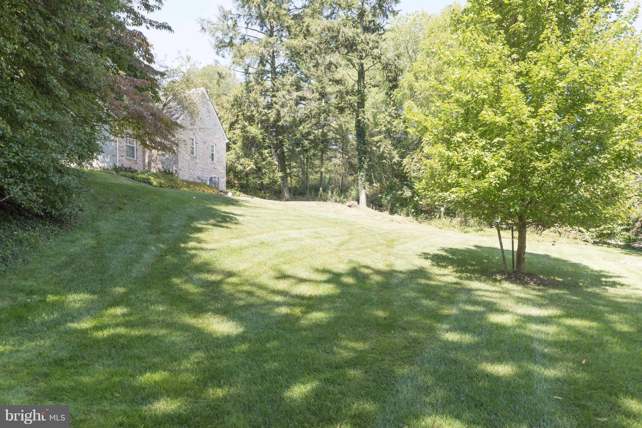 1908 Ruxton Road Baltimore, MD 21204 - Photo 27 of 29 a view of a yard with trees