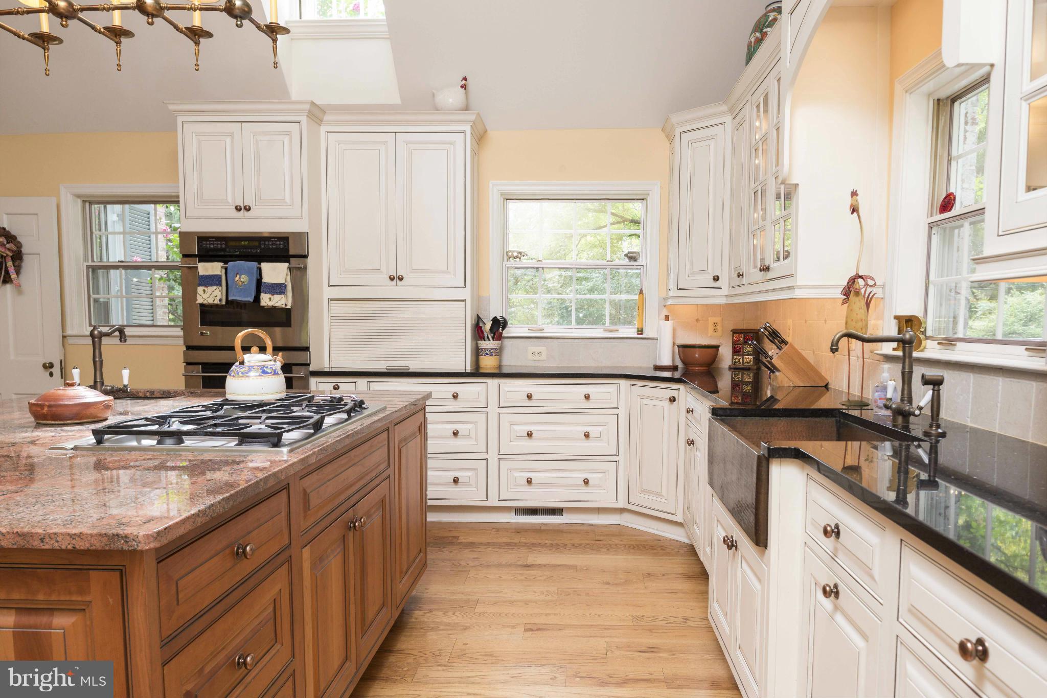 1908 Ruxton Road Baltimore, MD 21204 - Photo 6 of 29 a kitchen with stainless steel appliances granite countertop a stove sink and cabinets