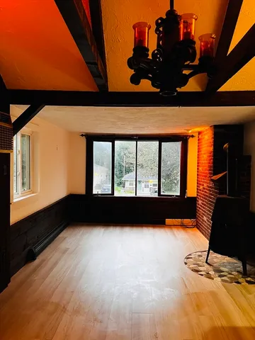 a view of a black and white wall with a large window