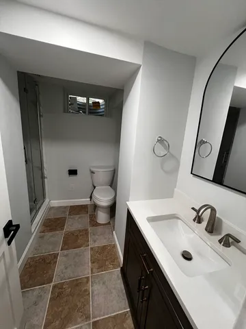 a bathroom with a sink and mirror