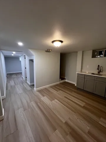 a view of a kitchen with a sink and cabinets