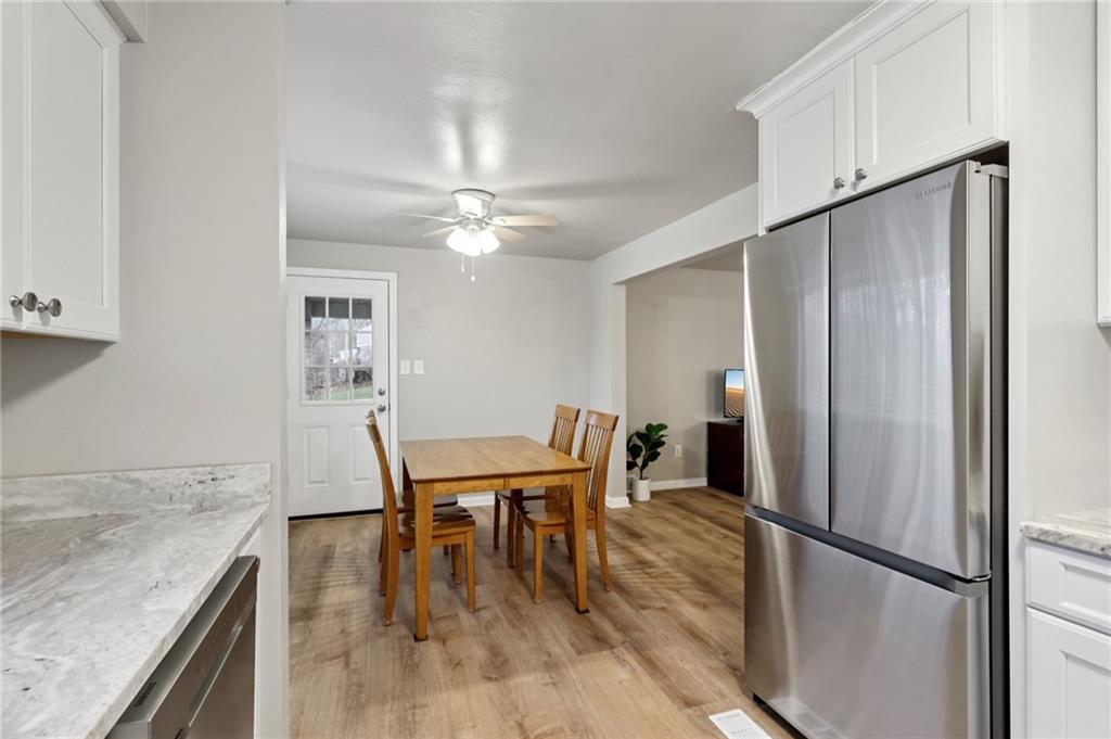 5374 Hardt Road Gibsonia, PA 15044 - Photo 11 of 49 a view of a kitchen with a table and chairs