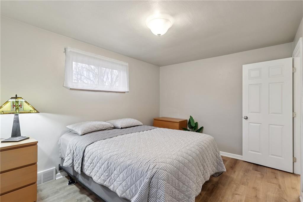 5374 Hardt Road Gibsonia, PA 15044 - Photo 16 of 49 a bedroom with a bed and wooden floor