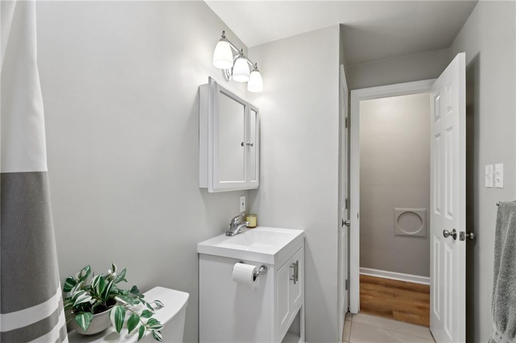 5374 Hardt Road Gibsonia, PA 15044 - Photo 19 of 49 a bathroom with a sink a mirror and a shower