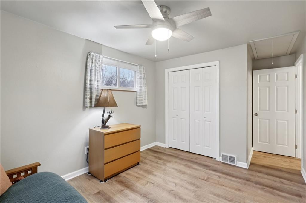 5374 Hardt Road Gibsonia, PA 15044 - Photo 21 of 49 a bedroom with a bed and a chandelier