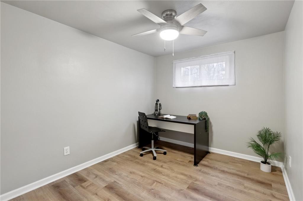 5374 Hardt Road Gibsonia, PA 15044 - Photo 22 of 49 a view of a workspace with wooden floor and a ceiling fan