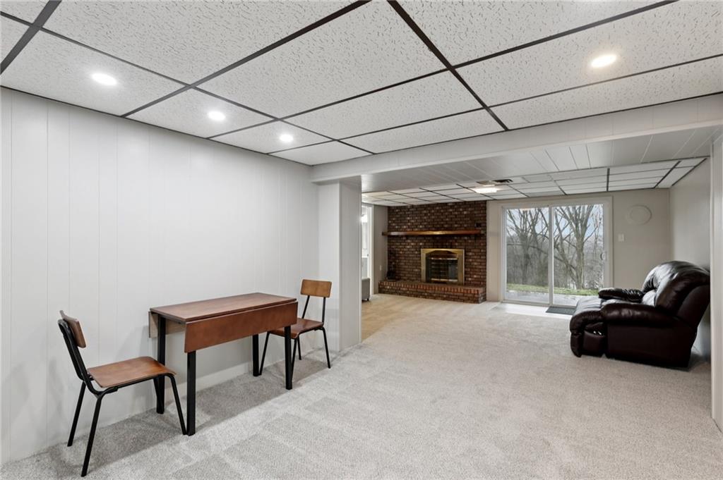 5374 Hardt Road Gibsonia, PA 15044 - Photo 26 of 49 a living room with furniture and a fireplace