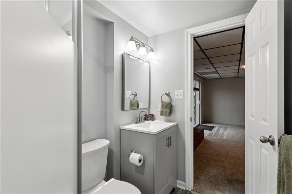 5374 Hardt Road Gibsonia, PA 15044 - Photo 28 of 49 a bathroom with a sink a toilet and mirror