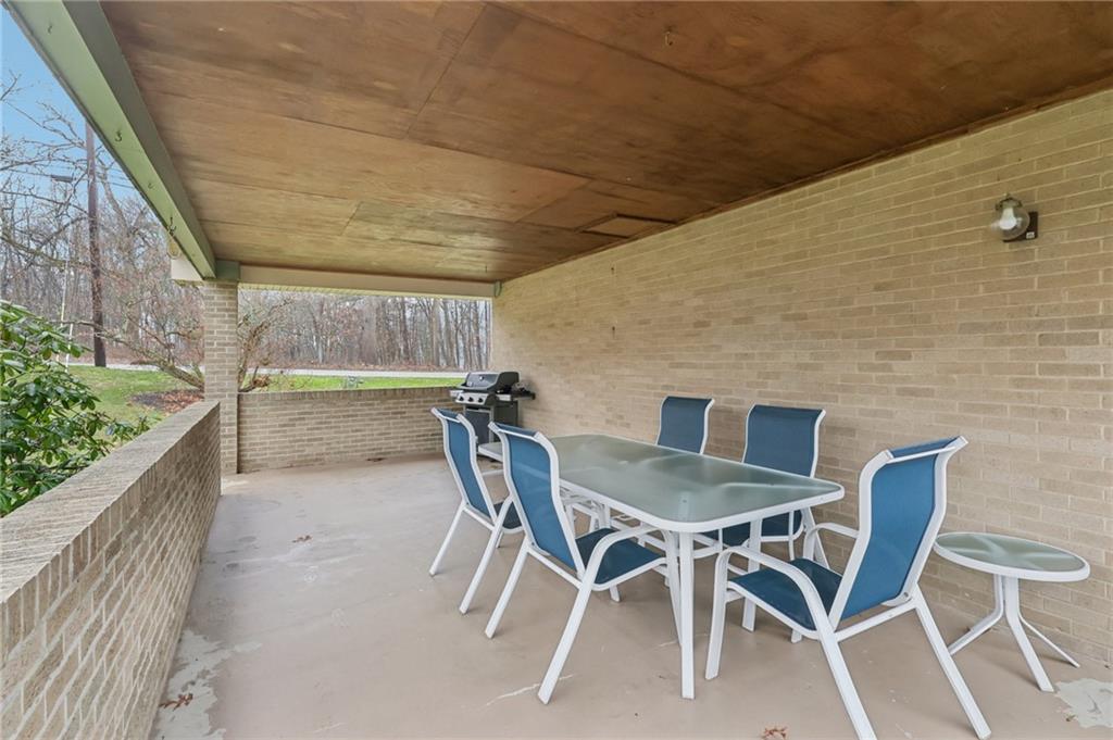 5374 Hardt Road Gibsonia, PA 15044 - Photo 32 of 49 a patio with table and chairs