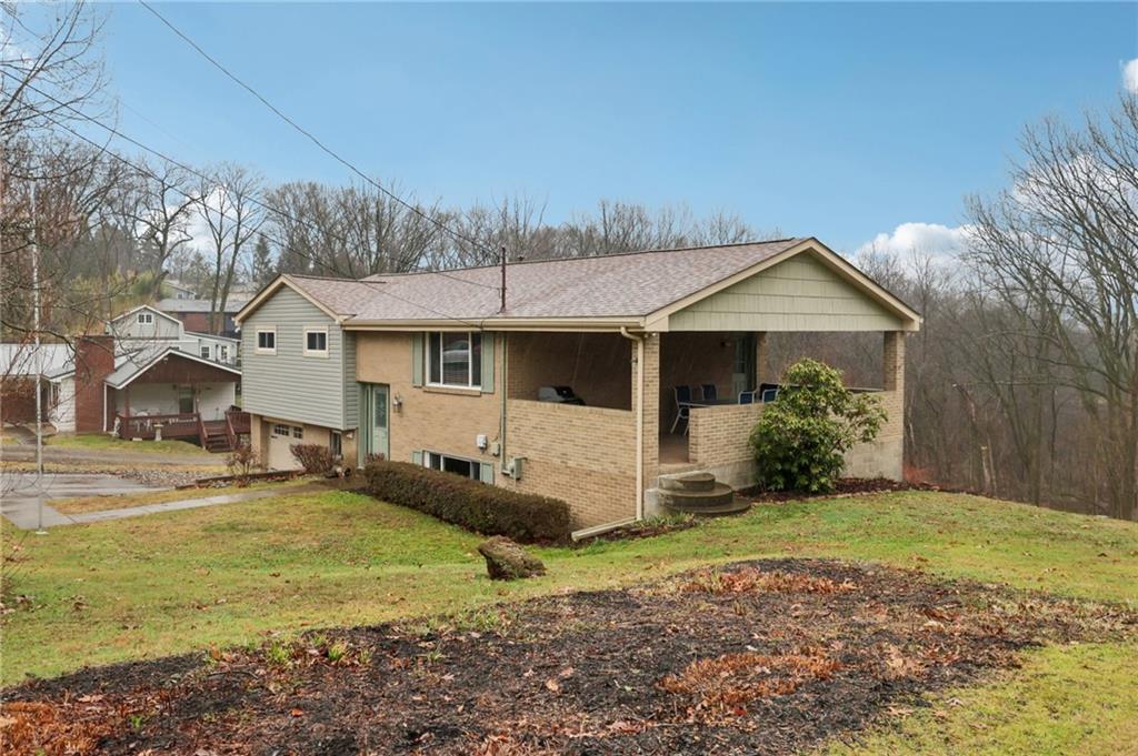 5374 Hardt Road Gibsonia, PA 15044 - Photo 49 of 49 a front view of a house with a yard