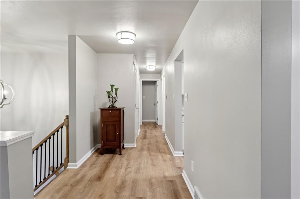 5374 Hardt Road Gibsonia, PA 15044 - Photo 7 of 49 a view of a hallway view with wooden floor and staircase