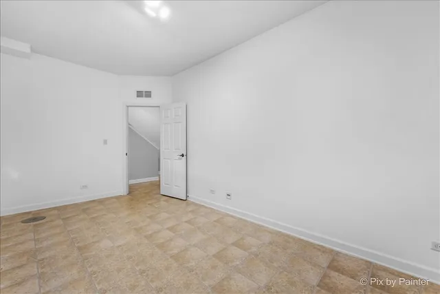 a view of a street with a building in the background