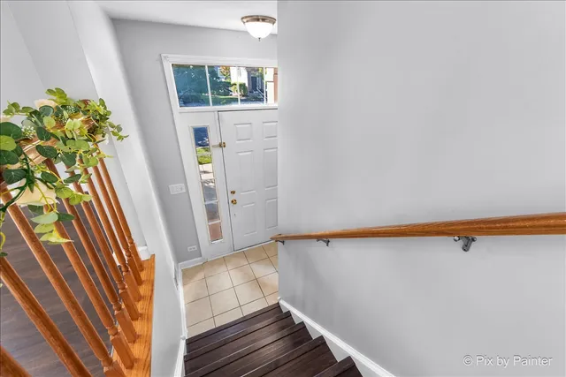 a view of small space with wooden floor and a window