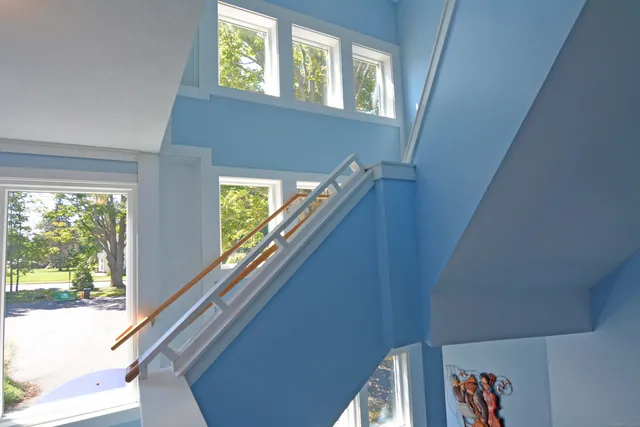 a view of balcony with wooden floor and stairs