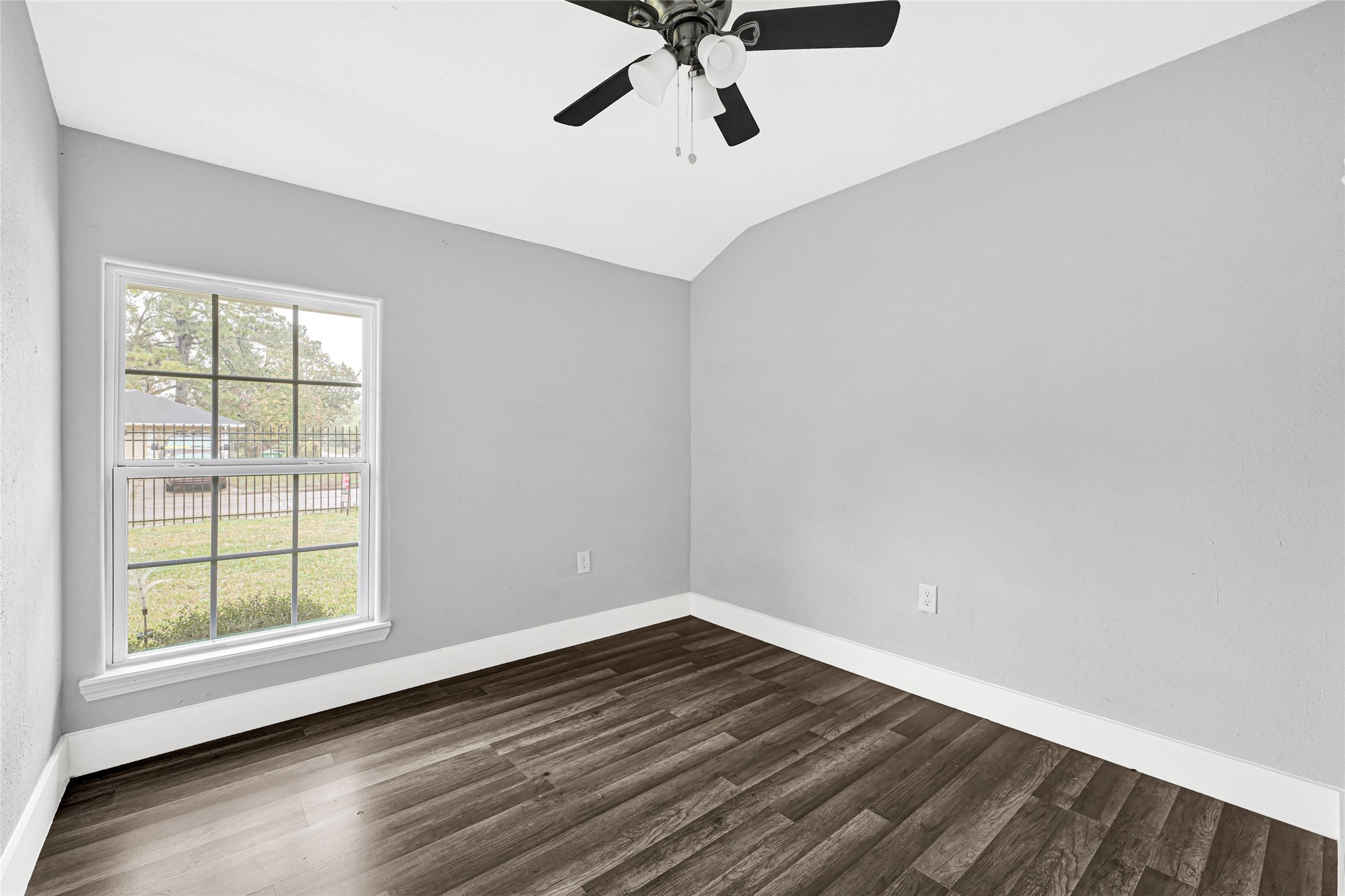 10842 Cheeves Drive Houston, TX 77016 - Photo 20 of 24 wooden floor in an empty room with a window