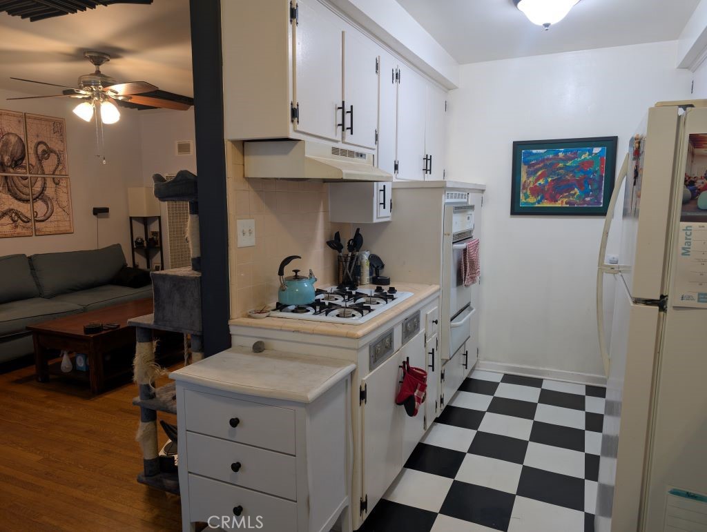 438 Cedar Avenue, Unit 4 Long Beach, CA 90802 - Photo 8 of 12 a kitchen with a sink a stove and cabinets