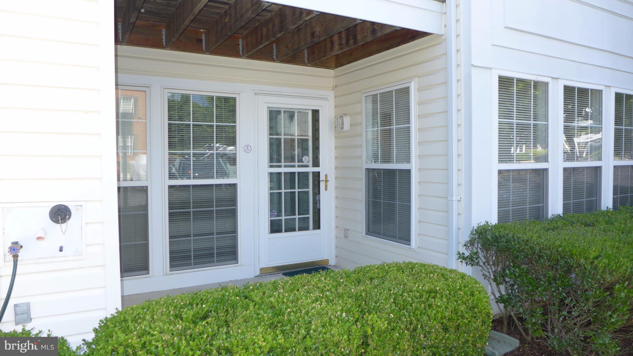 9746 Reese Farm Road, Unit 9746 Owings Mills, MD 21117 - Photo 2 of 22 a view of front door of house and yard